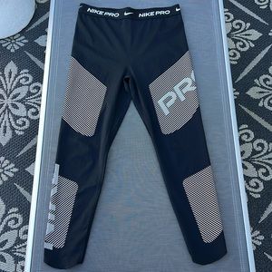 Nike Pro Dri-Fit Leggings. Black with tan & white accents. Size Large.